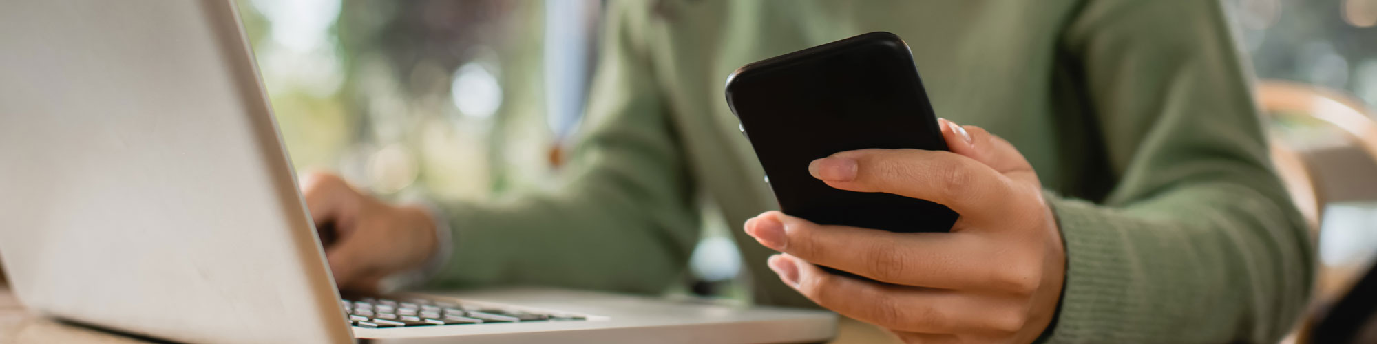 Man On Laptop And Mobile Device Man On Laptop And Mobile Device